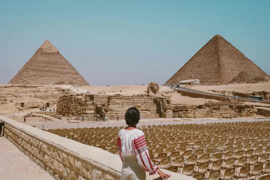 Indian tourist enjoying the view of the pyramids in egypt