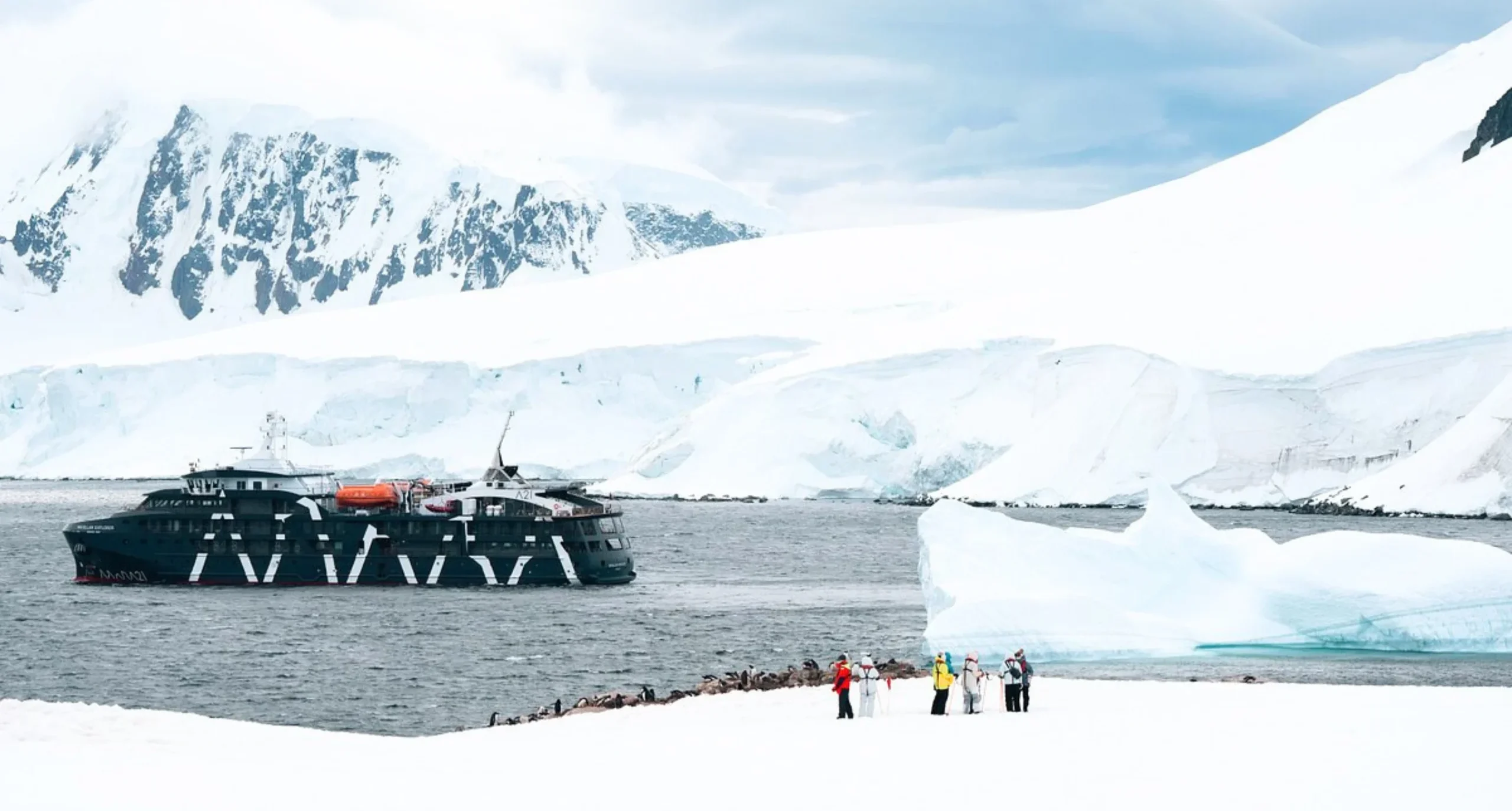 Image of guests and the vessel in the background